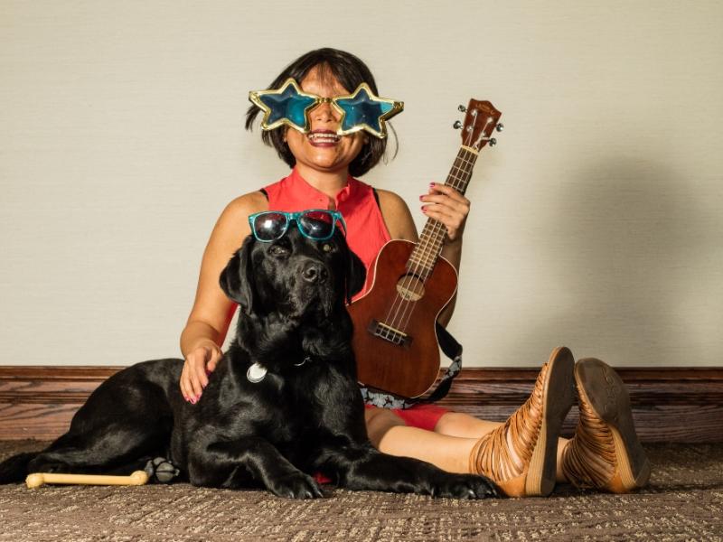 Vivian and her dog, both wearing sunglasses.